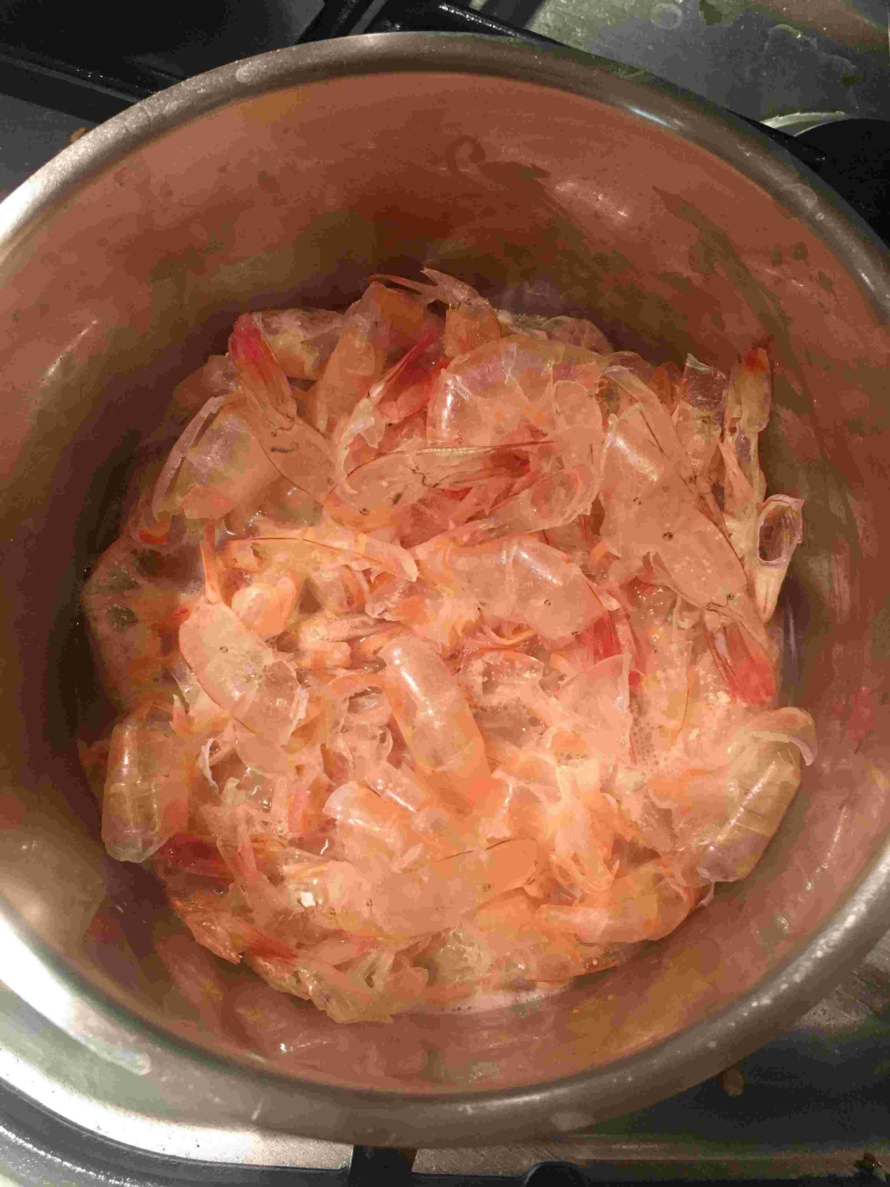 Shrimp shells turning pink after simmering